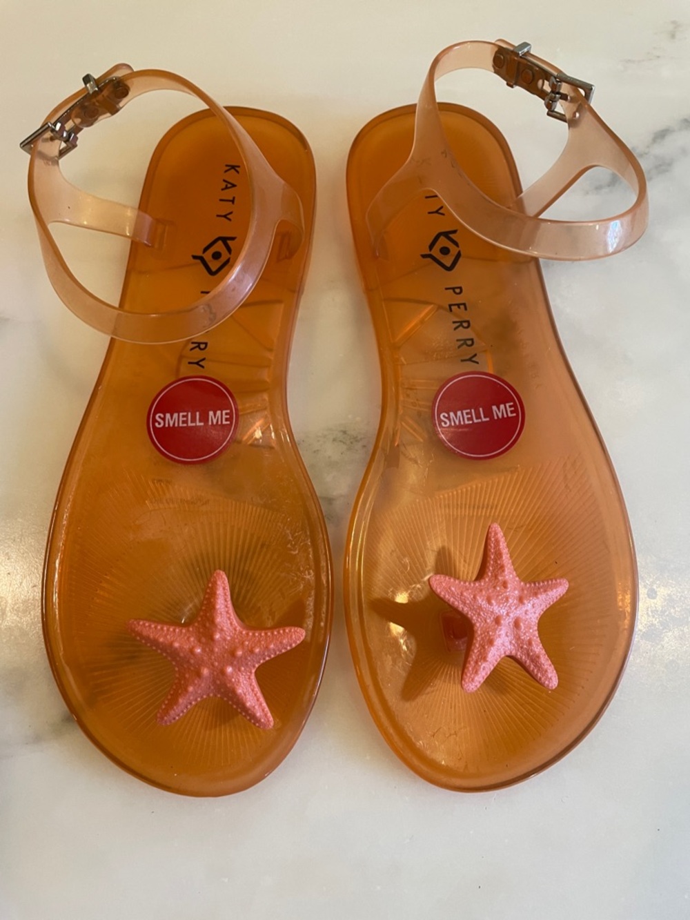 Katy Perry Orange Geli Sandals with a starfish ornament, Size 6